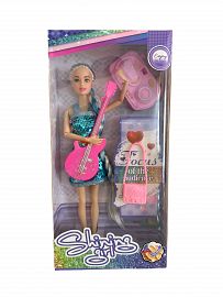 Muñeca con guitarra en caja